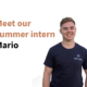 A photo of a person smiling. The person has short brown hair, and is wearing a dark-blue shirt with a white embroidery that says ENPULSION. Left of the person a text reads "Meet our summer intern Mario".