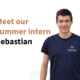 A photo of a person smiling. The person has short brown hair, blue eyes and is wearing a dark-blue shirt with a white embroidery that says ENPULSION. Left of the person a text reads "Meet our summer intern Sebastian".